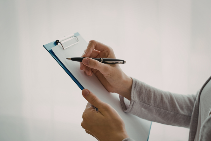 Person holding clipboard