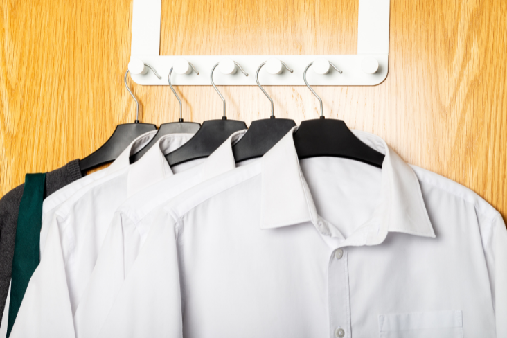 White shirts hanging on coat-hangers